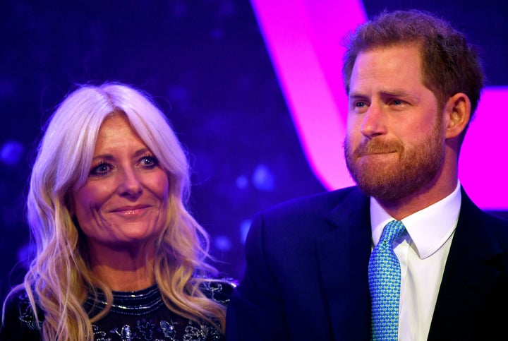 Prince Harry reacts next to television presenter Gaby Roslin as he delivers a speech during the WellChild Awards Ceremony reception in London on Oct. 15. 