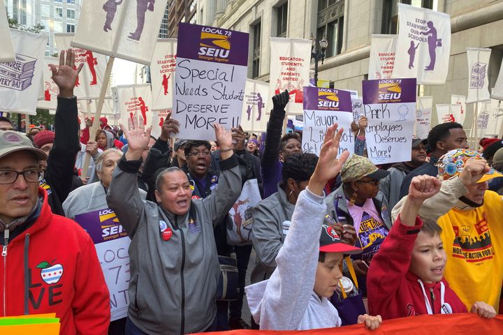 Hundreds of teachers and supporters march in Chicago on Monday, days before the teachers union was set to go on strike if a contract settlement was not reached.