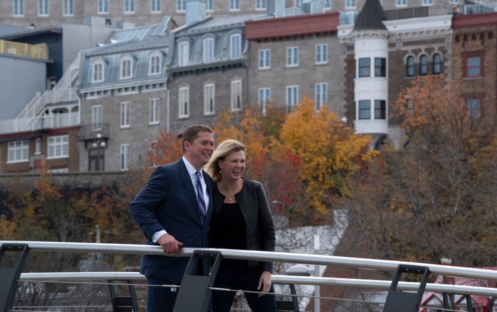 Conservative Leader Andrew Scheer and his wife Jill Scheer walk across a bridge following a campaign stop in Quebec City on Oct 15, 2019. 