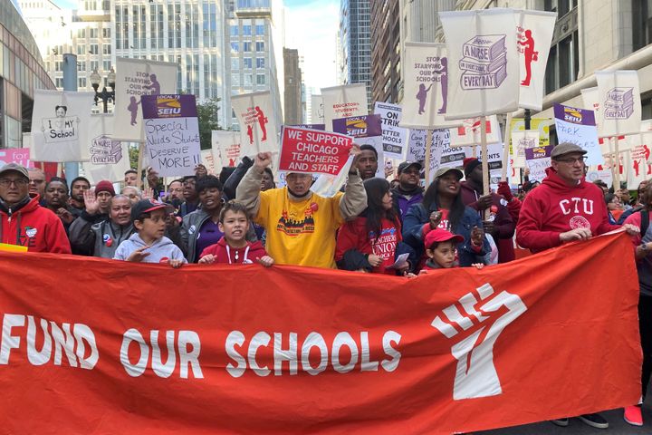 Hundreds of teachers and supporters march in Chicago on Monday, days before the teachers union was set to go on strike if a contract settlement was not reached.