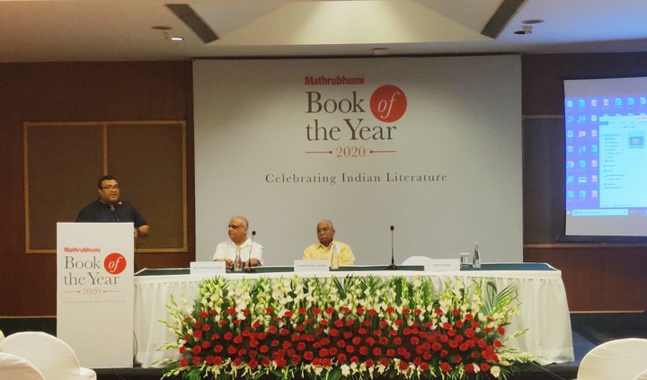 Sabin Iqbal, director of the Mathrubhumi Festival of Letters, speaks during the event. MV Shreyams Kumar and Chandrashekhara Kambara are also present. 