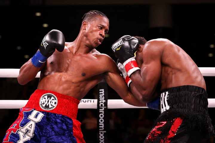 Patrick Day, left, lands a punch in the fatal bout against Charles Conwell on Saturday.