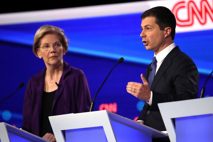 Sen. Elizabeth Warren (D-MA) looks on as South Bend, Indiana Mayor Pete Buttigieg speaks during the Democratic Presidential D
