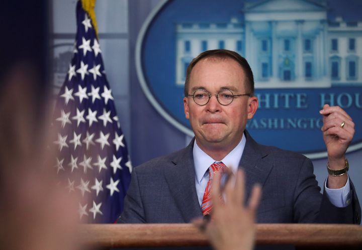 Acting White House chief of staff Mick Mulvaney answers questions from reporters at the White House on Thursday.