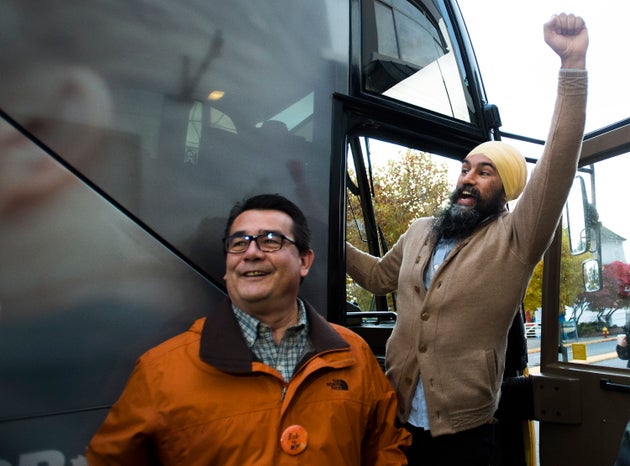 NDP Leader Jagmeet Singh, right, and MP Bob Chamberlin wave to supporters during a campaign stop in Nanaimo,...