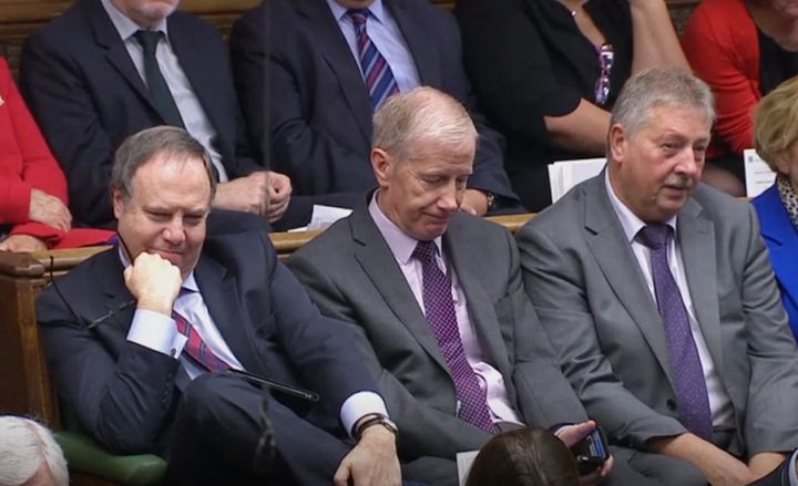 (Left to right) DUP MPs Nigel Dodds, Gregory Campbell, and Sammy Wilson listen as Prime Minister Boris Johnson delivers a statement in the House of Commons, London, to update the House on his new Brexit deal after the EU Council summit, on what has been dubbed "Super Saturday" .