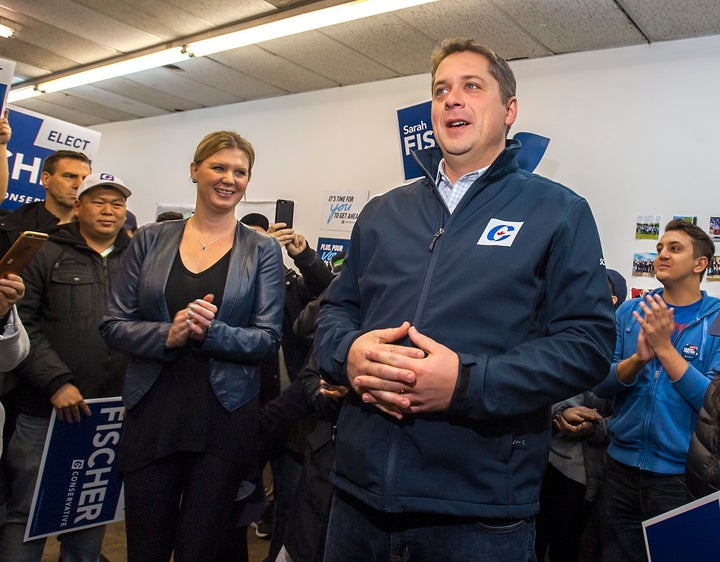 Andrew Scheer and his wife Jill campaign in Toronto on Oct. 19, 2019.