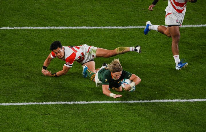 Chofu , Japan - 20 October 2019; Faf de Klerk of South Africa dives over to score his side's second try during the 2019 Rugby World Cup Quarter-Final match between Japan and South Africa at the Tokyo Stadium in Chofu, Japan. (Photo By Ramsey Cardy/Sportsfile via Getty Images)