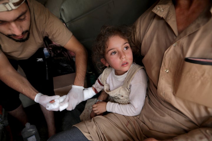 A wounded girl is treated in the town of Tal Abyad, Syria on Sunday.