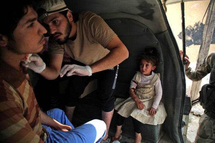 A Syrian man receives treatment on Sunday in the Syrian border town of Tal Abyad which was seized by Turkey-backed forces las