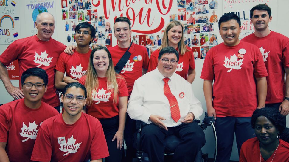 Kent Hehr, the Calgary Centre Liberal incumbent, poses for a photo with volunteers. 