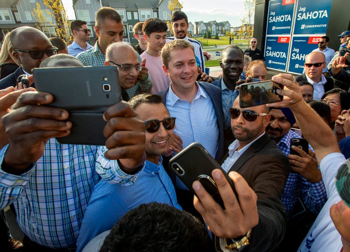 Federal Conservative Leader Andrew Scheer is mobbed by supporters at a campaign event in Calgary on Sept. 16, 2019.