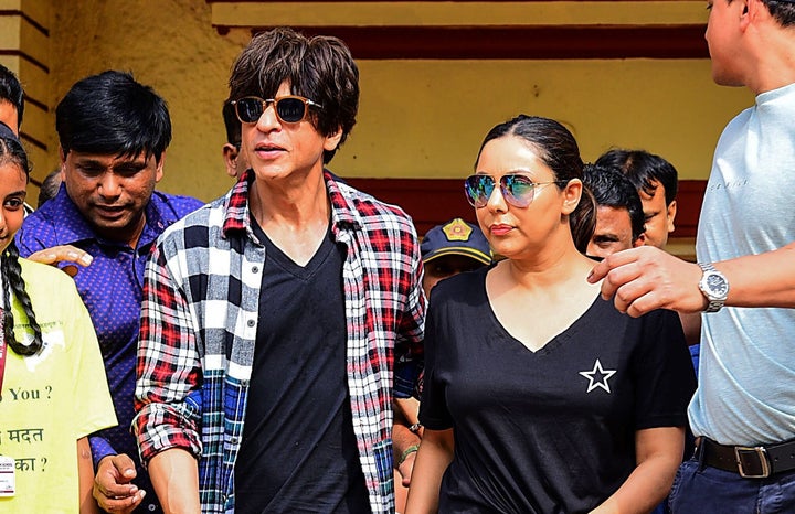 Shah Rukh Khan and Gauri Khan leave after casting their votes at a polling booth in Bandra West. 