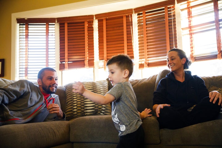 David Kulakowski, 38, and Jessica Kulakowski, 31, watch their 3-year-old son Chase Kulakowski, who has AFM, play in their Dye