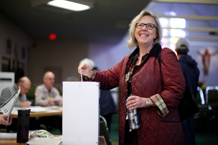 Elizabeth May casts her vote at St. Elizabeth's Parish while in Sidney, B.C., on Oct. 21, 2019. 
