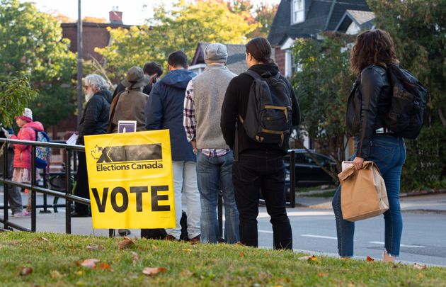 People line up to enter a polling station on election day of the 2019 federal election, in Ottawa on Oct. 21, 2019. 