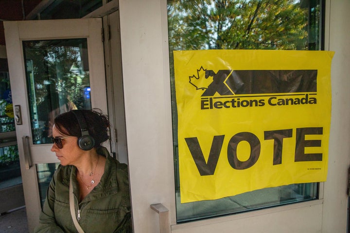 People line up to vote at a polling station in Toronto for the federal election on Oct. 21, 2019.