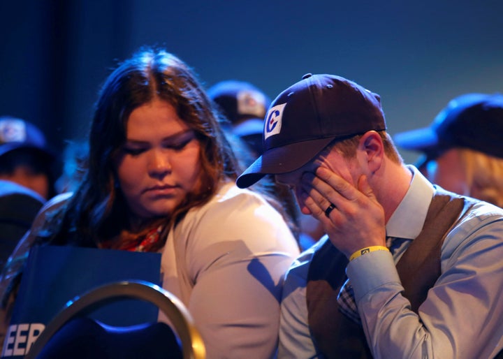 Conservative supporters watch the election results come in at Andrew Scheer's campaign headquarters in Regina on Oct. 21, 2019. 