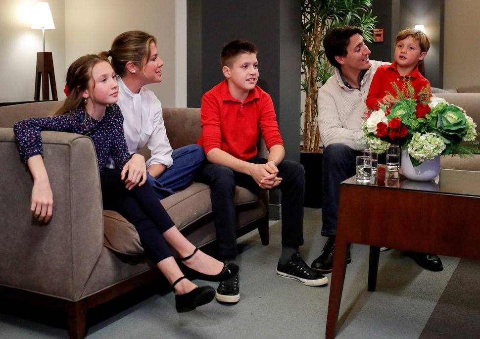 Liberal Leader Justin Trudeau and his wife Sophie Grégoire Trudeau, sons Xavier and Hadrien, and daughter Ella-Grace watch the initial results from the federal election in Montreal on Oct. 21, 2019. 