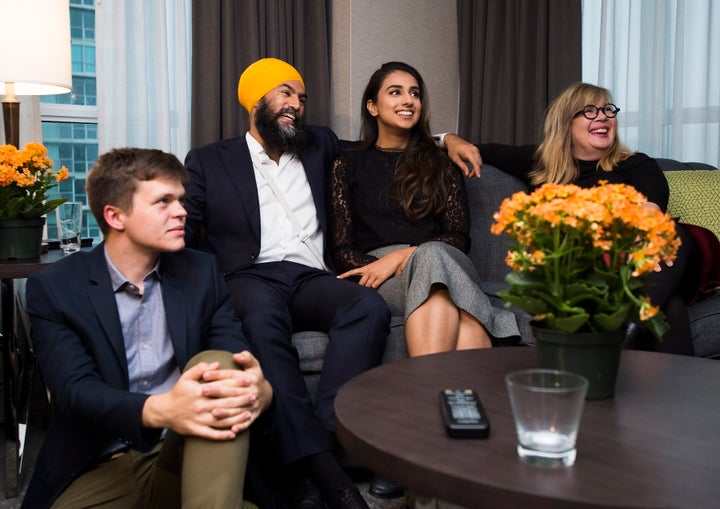 NDP Leader Jagmeet Singh, second left, and his wife Gurkiran Kaur, second right, watch the election results come in at his hotel room in Burnaby, B.C. on Oct. 21, 2019.