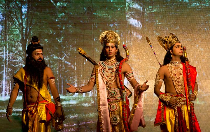 Artists dressed as Rama, center, and his brother Lakshman during a Ramleela play in Allahabad on 21 September, 2017. 
