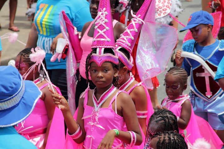 Kids celebrate Crop Over in Barbados in costumes that are considered appropriate for the festival. 