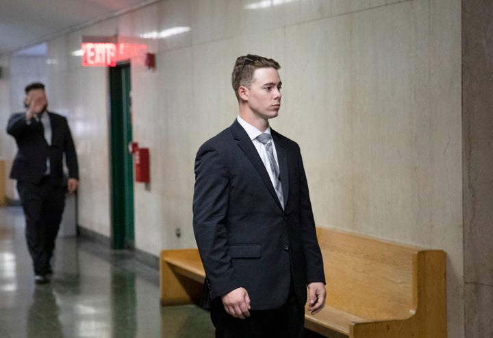 Maxwell Hare, center, and John Kinsman, left, arrive at court during their trial in New York. The two members of the far-right Proud Boys group were convicted for their roles in a violent clash with left-wing protesters in October 2018 following a speech at the Metropolitan Republican Club in New York.