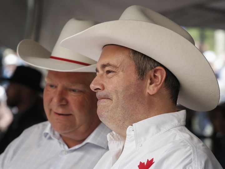 Premiers Jason Kenney, right, of Alberta, and Doug Ford, of Ontario, attend the Premier's Stampede Breakfast in Calgary, Monday, July 8, 2019. 