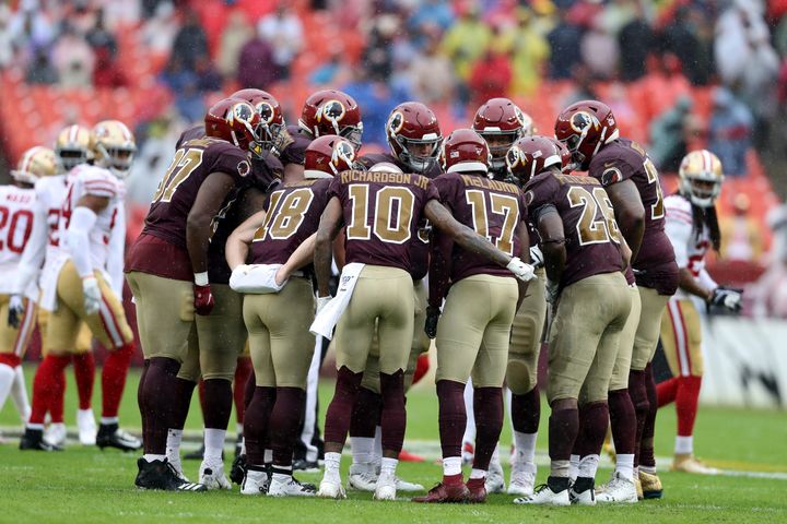 The Washington football team's offense huddles during a game against the San Francisco 49ers at FedExField on October 20, 2019 in Landover, Maryland.