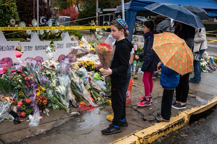 Children pay their respects at a memorial site outside the Tree of Life synagogue in Pittsburgh on Oct. 31, 2018.