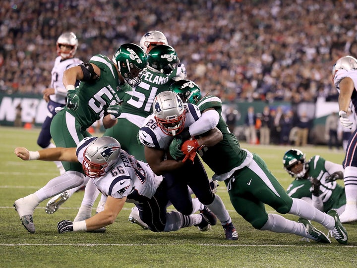 Sony Michel #26 of the New England Patriots rushes for his second touchdown in the first quarter against the New York Jets during their game at MetLife Stadium on October 21, 2019 in East Rutherford, New Jersey.