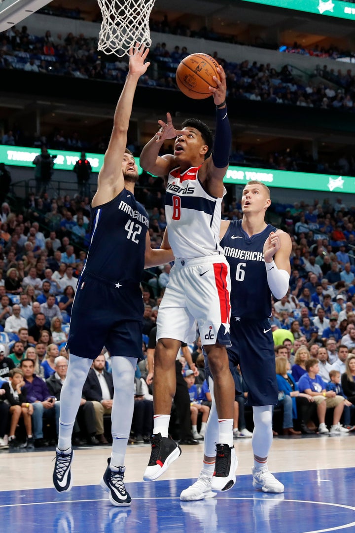 Washington Wizards' Rui Hachimura (8) heads to the basket as Dallas Mavericks' Maxi Kleber (42) and Kristaps Porzingis (6) defend during the first quarter of an NBA basketball game in Dallas, Wednesday, Oct. 23, 2019. (AP Photo/Tony Gutierrez)