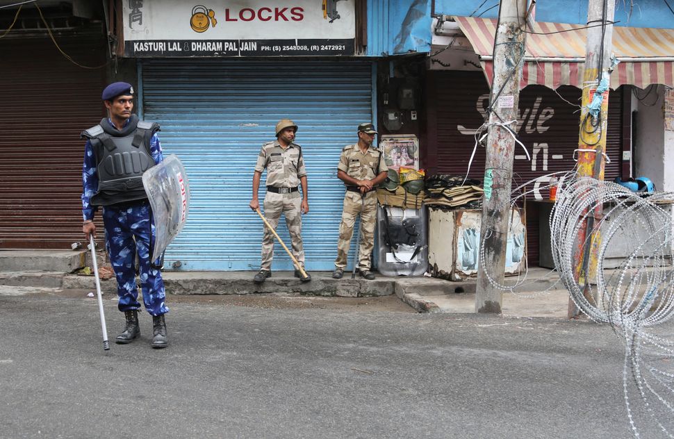 Security personnel stand guard in in Jammu on 9 August, 2019. 