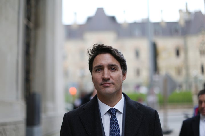 Prime Minister Justin Trudeau walk back to his office after for a news conference on Oct. 23, 2019 in Ottawa.