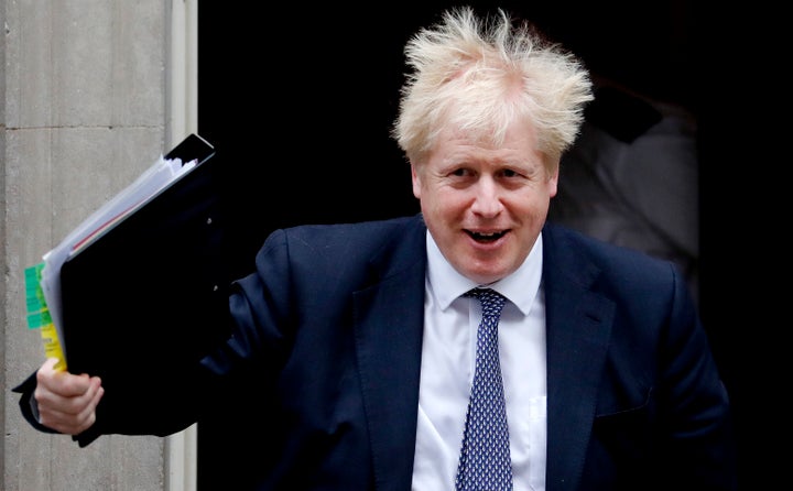 Britain's Prime Boris Johnson leaves 10 Downing Street to attend the weekly Prime Ministers' Questions in Parliament in London on Wednesday.