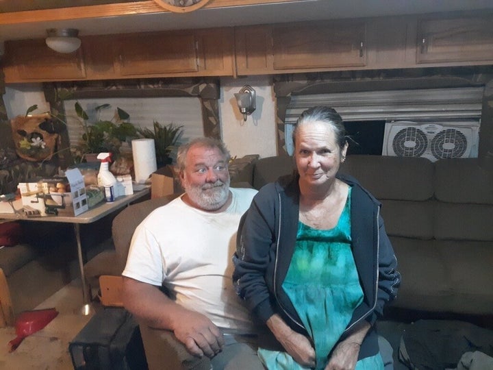 Therese and John Rubiolo sit in a trailer in Concow, California, where they've been living since the Camp fire destroyed their home.