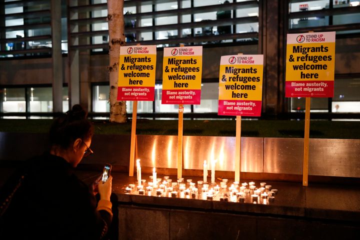 Anti-racism campaigners attend a vigil outside the Home Office in Westminster, London, for the 39 people found dead inside a lorry in Essex.