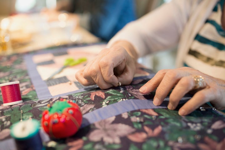 A "massive" unfinished quilt has brought together more than 30 strangers who are completing a 99-year-old's woman's work.