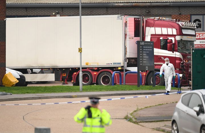 The container lorry where 39 people were found dead inside leaves Waterglade Industrial Park in Grays, Essex, heading towards Tilbury Docks under police escort