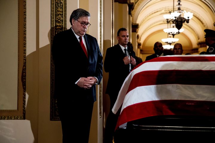 US Attorney General William Barr pays his respects at the casket of US Representative Elija­h Cummi­ngs on Thursday.