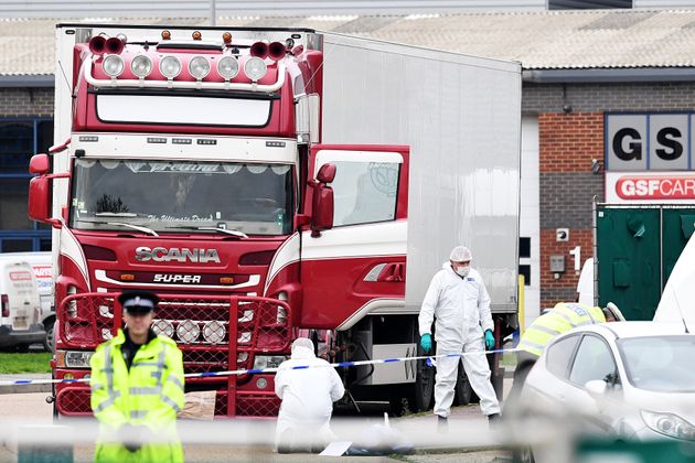 Police and forensic officers investigate a lorry in which 39 bodies were discovered in the trailer on Wednesday morning. 