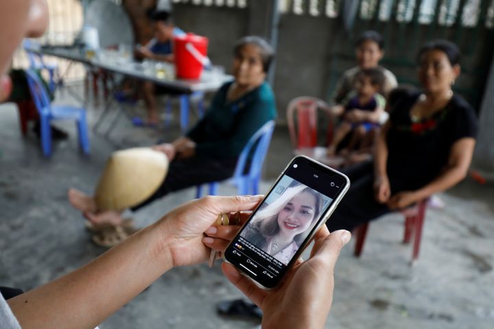 A relative looks at an image of Anna Bui Thi Nhung, a Vietnamese suspected victim in a truck container in UK, at her home in Nghe An province, Vietnam October 26, 2019. REUTERS/Kham