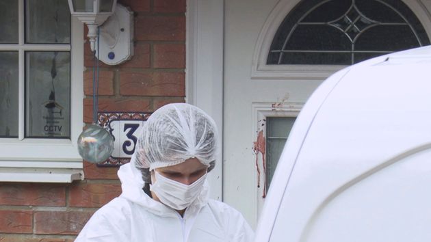 Forensic police attend the scene where two teenage boys were stabbed to death Saturday night following an altercation, in Milton Keynes, southern England, Sunday Oct. 20, 2019.  One of the the 17-year-old victims, who have not been named by police, died at the scene, while the other died early Sunday morning in hospital. (Andy Wasley/PA via AP)