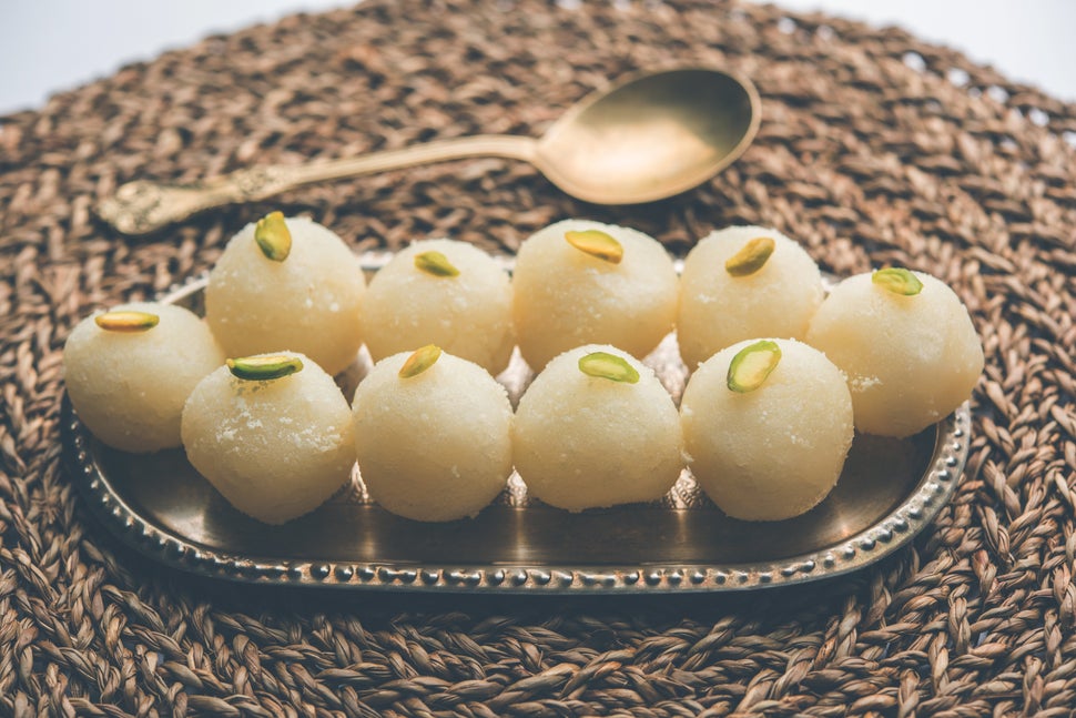 Indian Rasgulla or dry Rosogulla dessert/sweet served in a bowl. selective focus