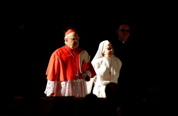 A cardinal and a nun arrive to attend a mass to close a three-week synod of Amazonian bishops at the Vatican, October 27, 2019. 