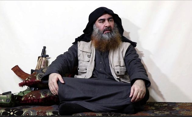 FILE - This file image made from video posted on a militant website April 29, 2019, purports to show the leader of the Islamic State group, Abu Bakr al-Baghdadi, being interviewed by his group's Al-Furqan media outlet. The IS erupted from the chaos of Syria and Iraq's conflicts and swiftly did what no Islamic militant group had done before, conquering a giant stretch of territory and declaring itself a 