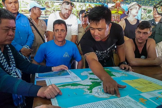 Rescuers meet during a search and rescue operation on Koh Rong island