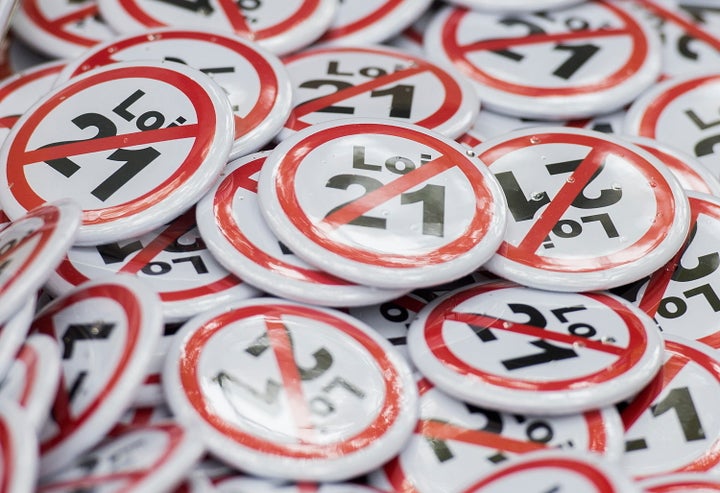 A box of buttons that oppose Quebec's Bill 21 are seen here during a demonstration in Montreal on Oct. 6, 2019. The law bans public sector workers from wearing religious symbols on the job.