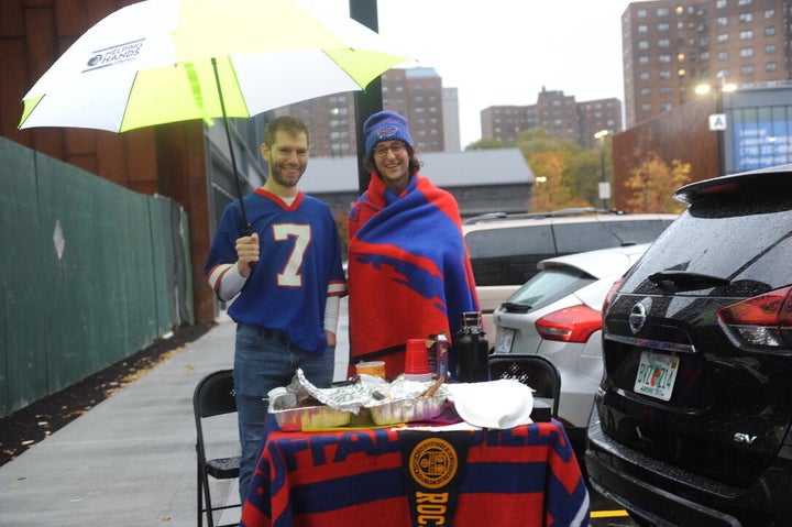 Brad Orego (L) and Jeff Pollock hunkered down for a tailgate in the Wegmans parking lot. “We’re planning to watch the Bills/Eagles game at the bar upstairs,” Orego told HuffPost.