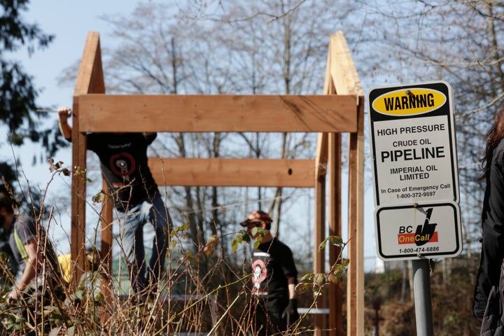 A traditional Coast Salish Watch House under construction, adjacent to Kinder Morgan's Trans Mountain pipeline, built in protest to the pipeline expansion in Burnaby, B.C., March 10, 2018.